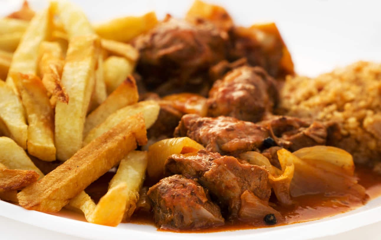 Choto al ajillo, kid goat fried with garlic, a classic dish of the inland Axarquía